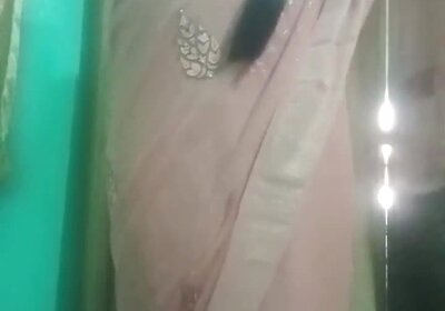 Indian trans woman Gaurisissy pressing and milking her boobs in pink saree
